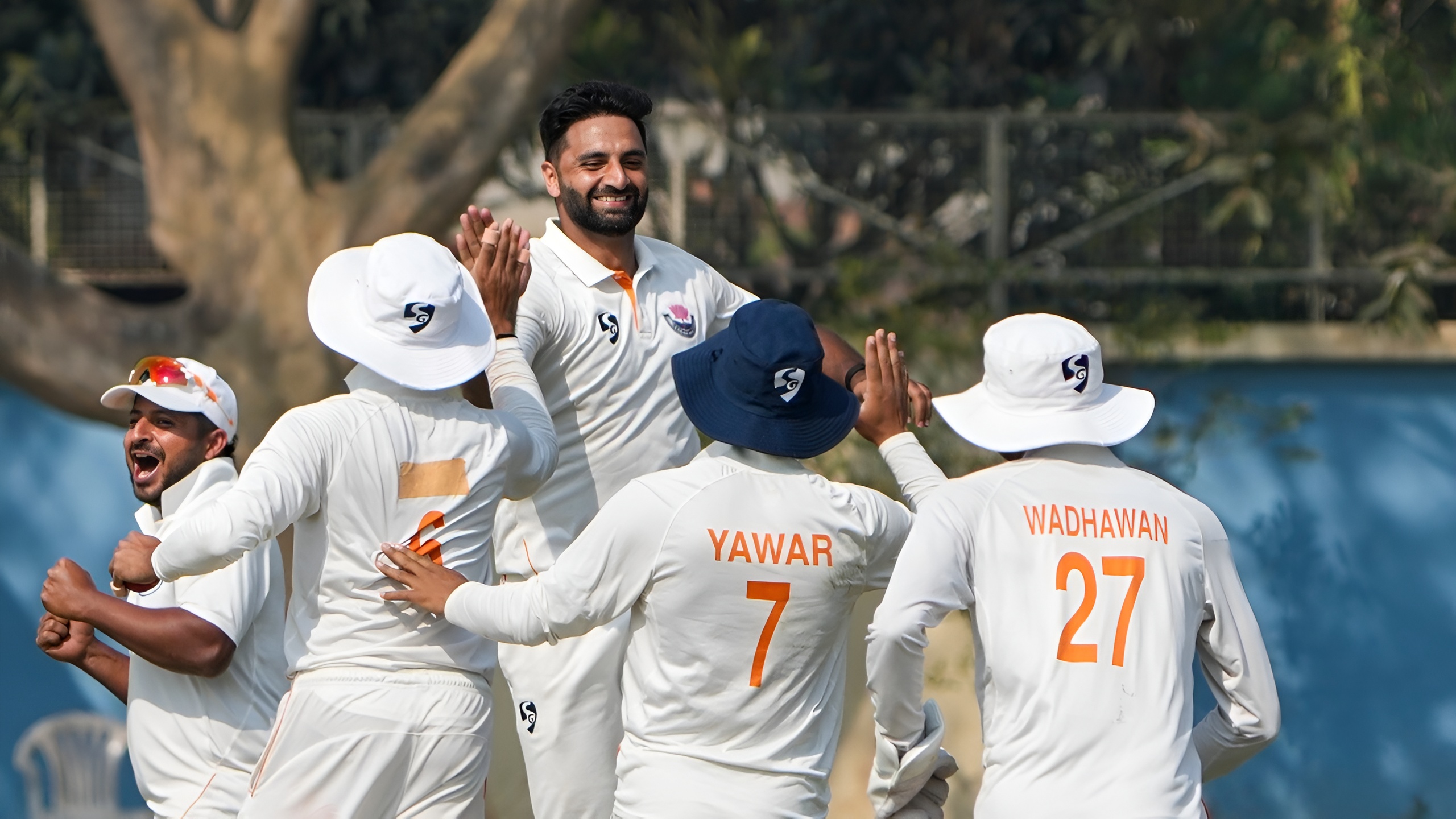 Auqib Nabi and the Jammu and Kashmir side celebrate a dismissal against Bengal in the semifinal of the Ranji Trophy 2025-26 campaign in Kalyani.